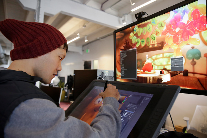 In this photo taken Tuesday, Nov. 17, 2015, an art director works on visual development at the Oculus Story Studio, a hub for digital animators and experimental filmmakers in San Franciscos trendy South of Market district. Storytelling techniques in virtual reality are just in their infancy, and the consumer version of the industry-leading headset Oculus Rift is only due to ship later in March 2016. (AP Photo/Eric Risberg)